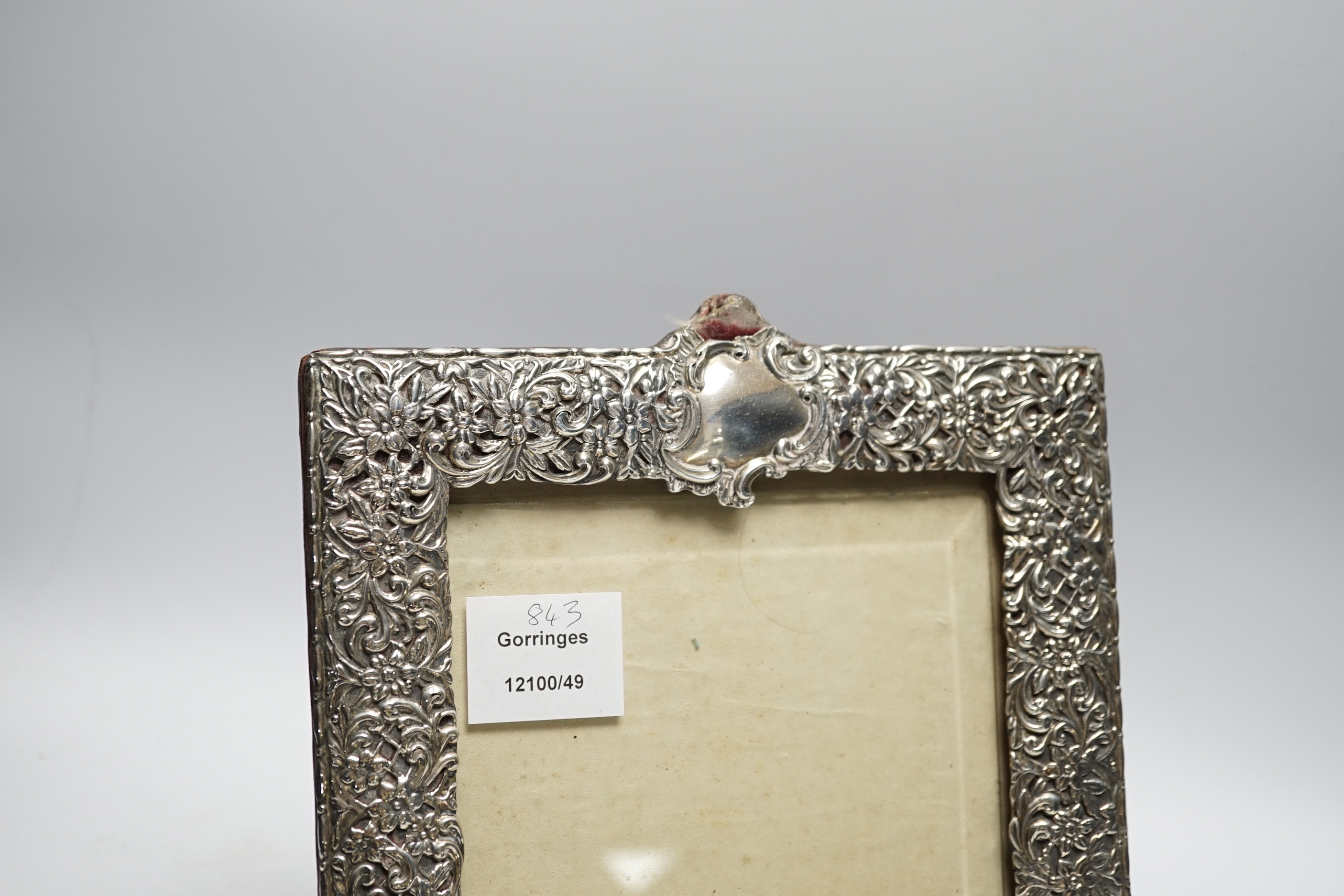 A late Victorian repousse silver mounted photograph frame, Birmingham, 1894, 29cm (a.f.)